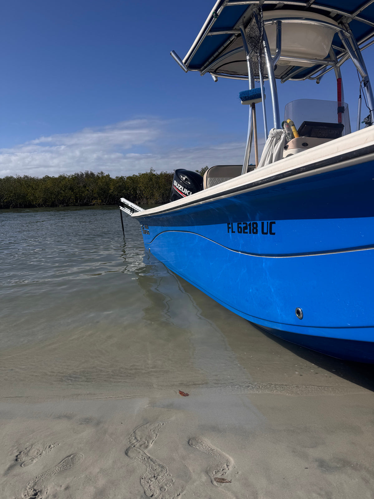 The skiff beached on a Mosquito Lagoon sandbar
