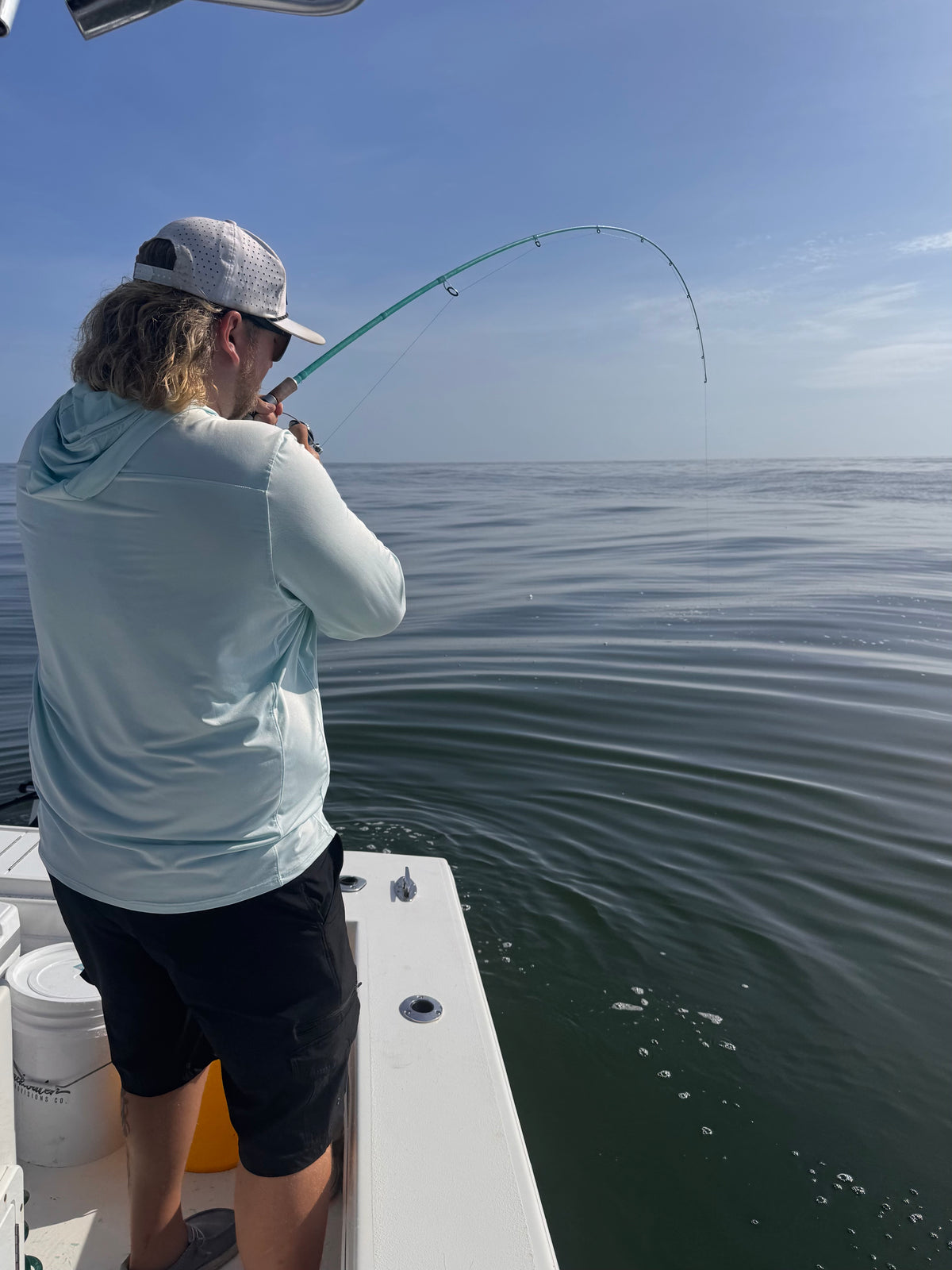Angler fighting a fish on the flats