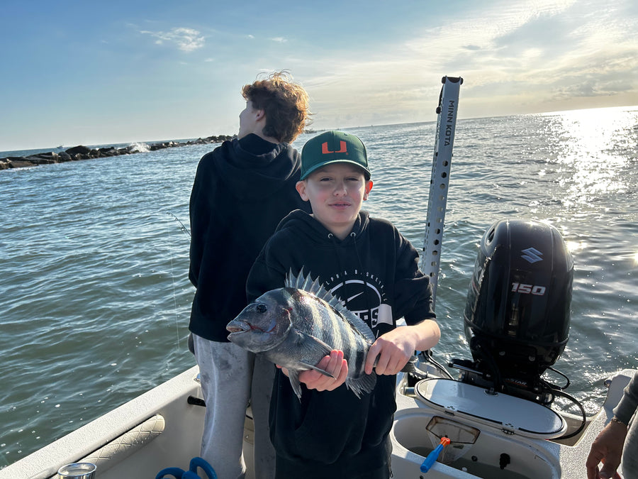 Young angler with a sheepshead at the jetty