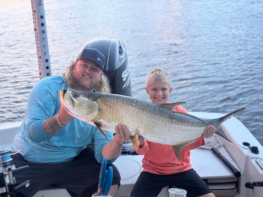Father and son with a redfish