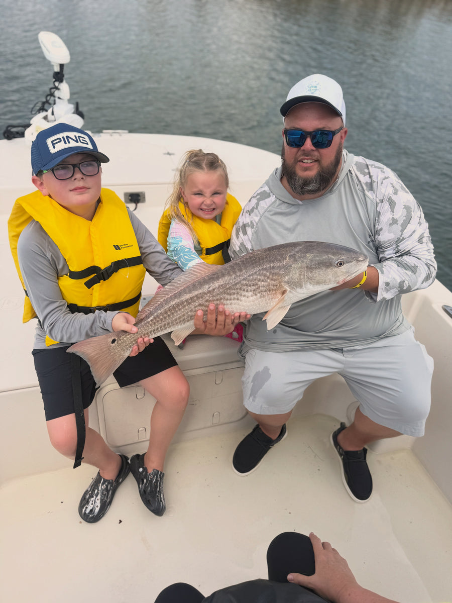 Kids with a redfish